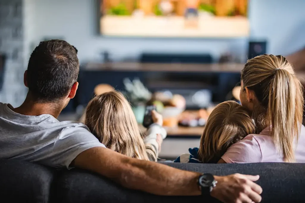 Family watching IPVario IPTV together on the living room TV